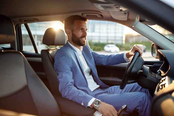 man driving nice car